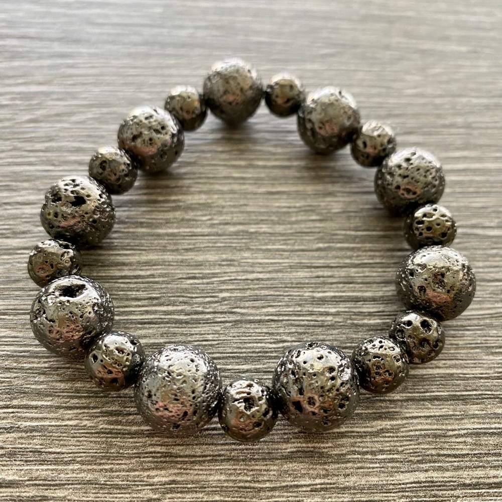 Women’s gunmetal plated lava bracelet.  One size